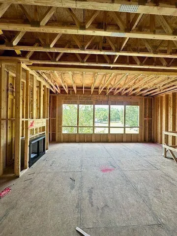 a view of a lake with a house in the background