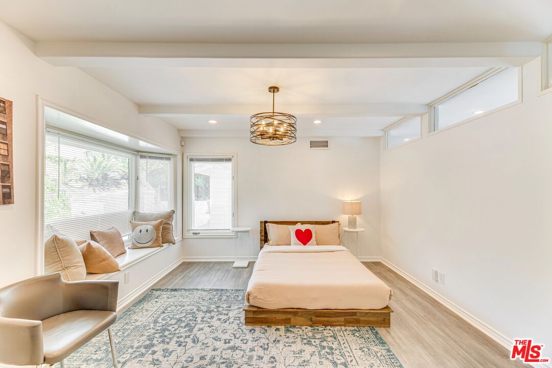 1410 Stradella Road Los Angeles, CA 90077 - Photo 21 of 42 a bedroom with a bed and a large window