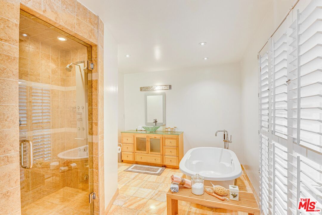 1410 Stradella Road Los Angeles, CA 90077 - Photo 29 of 42 a bathroom with a sink a toilet and shower