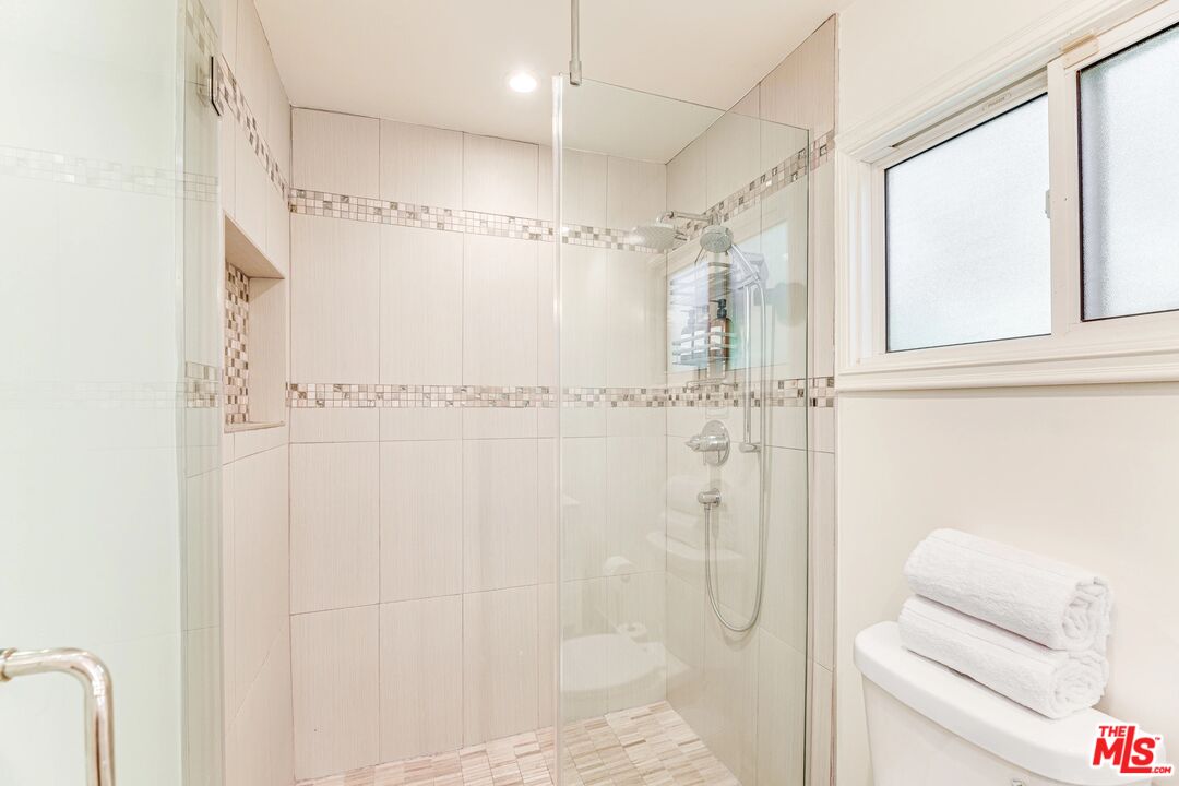1410 Stradella Road Los Angeles, CA 90077 - Photo 34 of 42 a bathroom with a shower