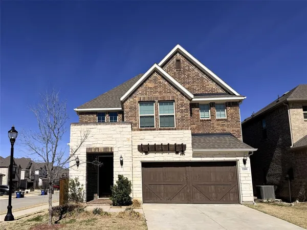 a front view of a house with a garage