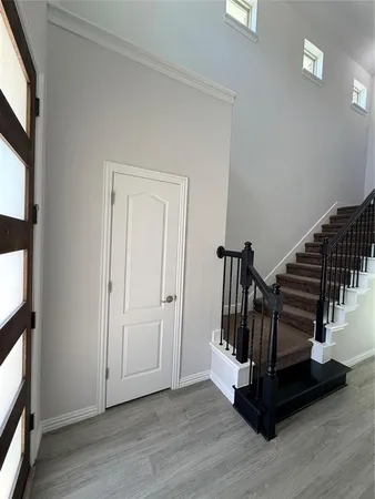 a view of entryway with stairs and wooden floor