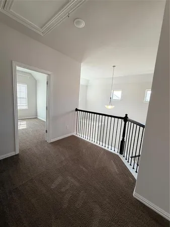 an empty room with staircase