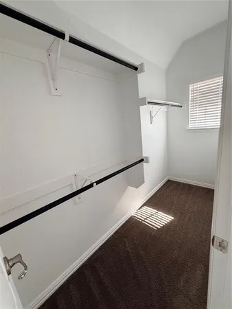 a view of walk in closet with window