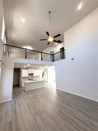 a view of a livingroom with wooden floor