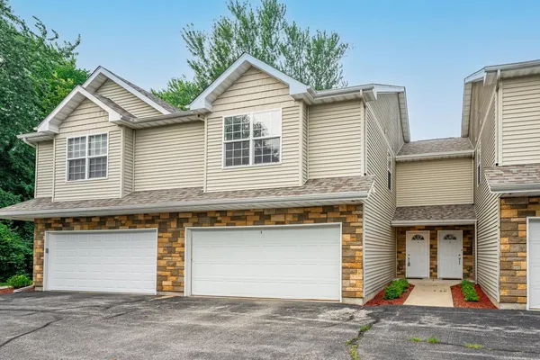 a front view of a house with yard
