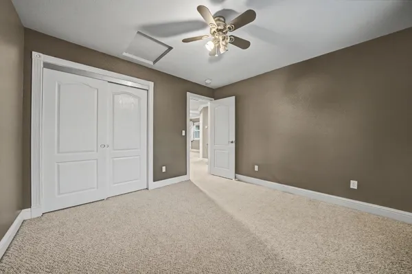 a view of a hallway with wooden floor and entryway
