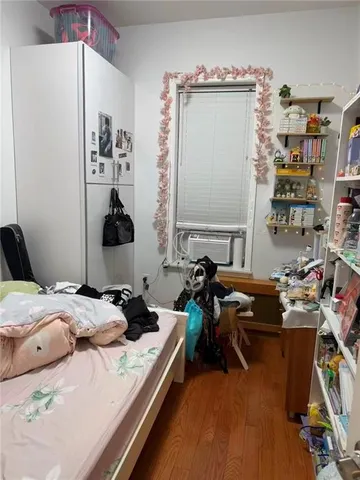 a bed room with a bed and a chair