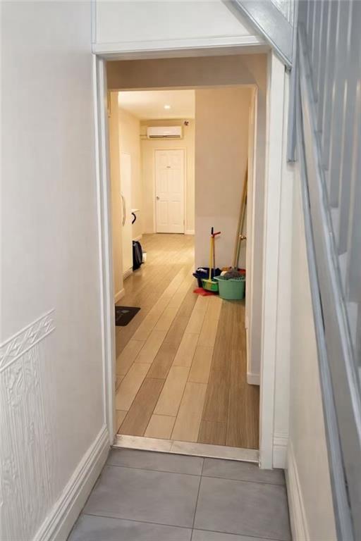 5409 6th Avenue Brooklyn, NY 11220 - Photo 9 of 12 wooden floor with a bathroom