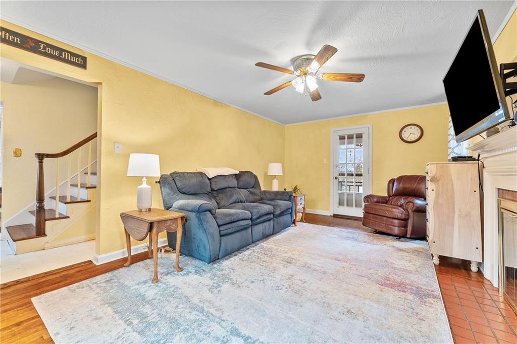 762 Scott Road Pittsburgh, PA 15228 - Photo 6 of 39 Expansive living room with hard wood floors, fireplace, and deck access!