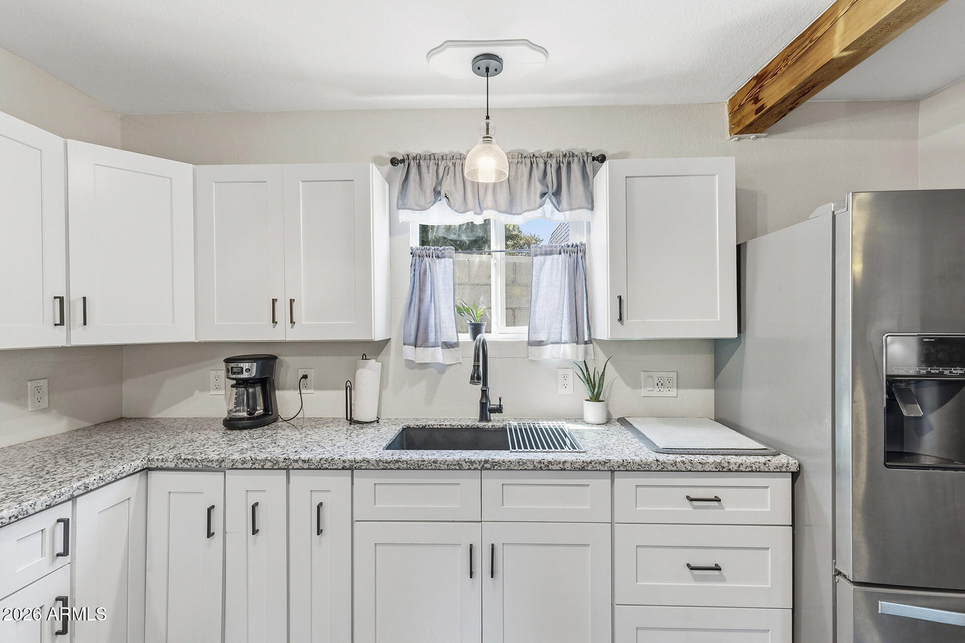 5228 North 15th Street Phoenix, AZ 85014 - Photo 73 of 96 a kitchen with granite countertop a sink stainless steel appliances and cabinets