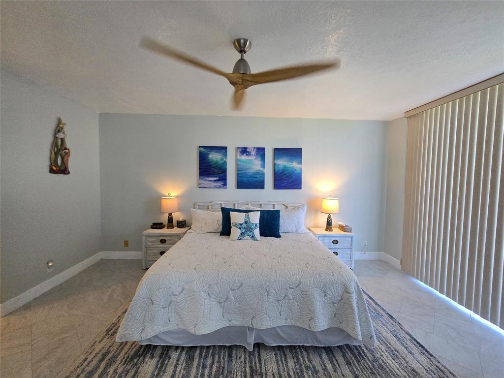 3120 North Hwy A1A, Unit 1302 Fort Pierce, FL 34949 - Photo 13 of 33 a bed room with a bed and a window
