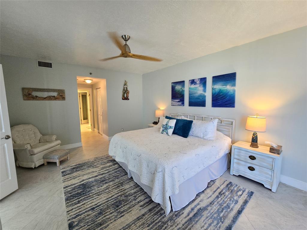 3120 North Hwy A1A, Unit 1302 Fort Pierce, FL 34949 - Photo 14 of 33 a bedroom with bed and window