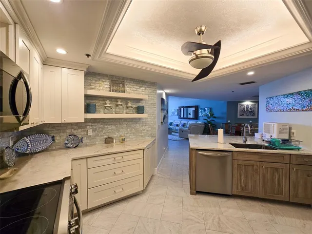 a kitchen with a sink and cabinets