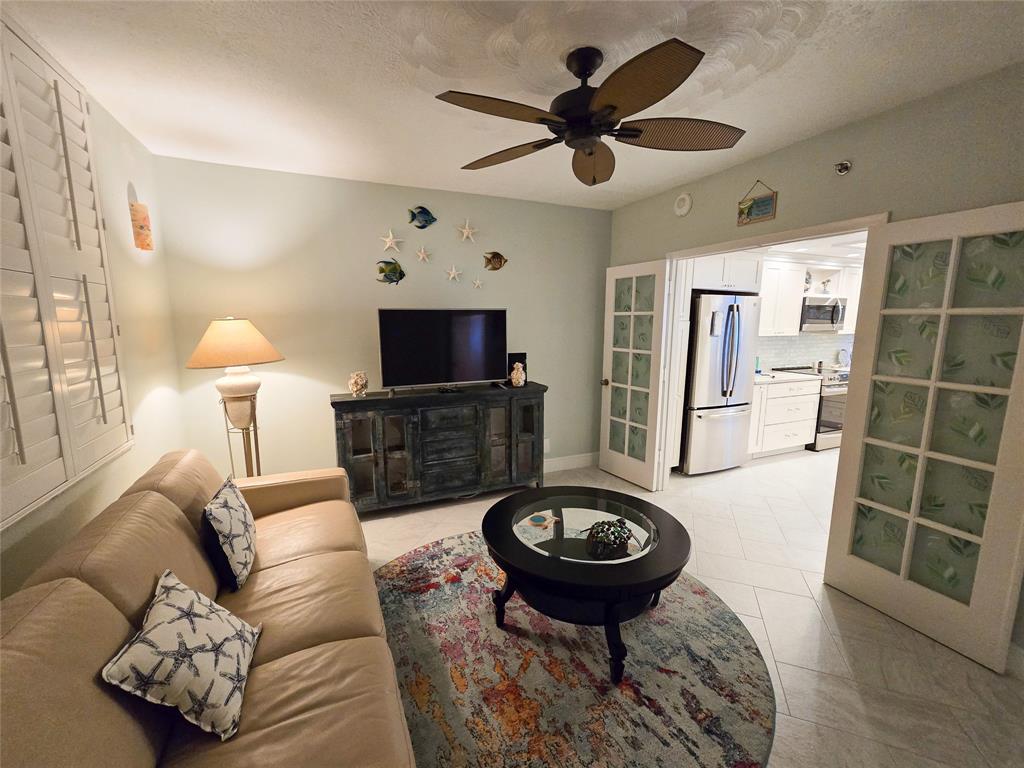 3120 North Hwy A1A, Unit 1302 Fort Pierce, FL 34949 - Photo 21 of 33 a living room with furniture and a fireplace