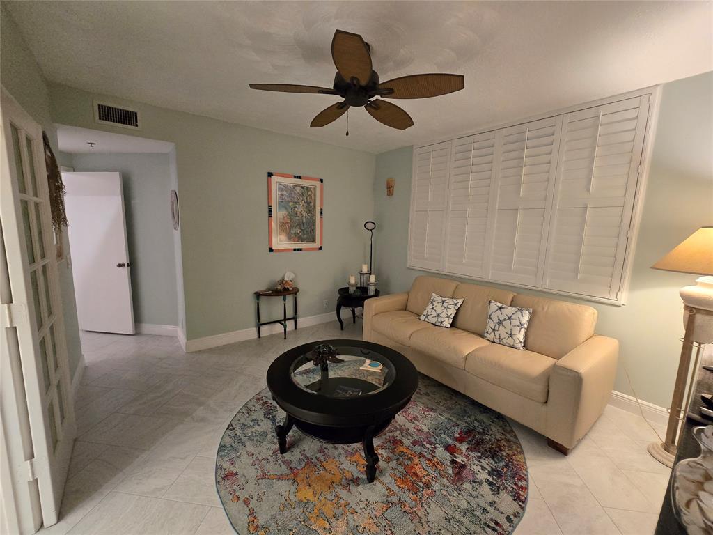 3120 North Hwy A1A, Unit 1302 Fort Pierce, FL 34949 - Photo 22 of 33 a living room with furniture and a rug