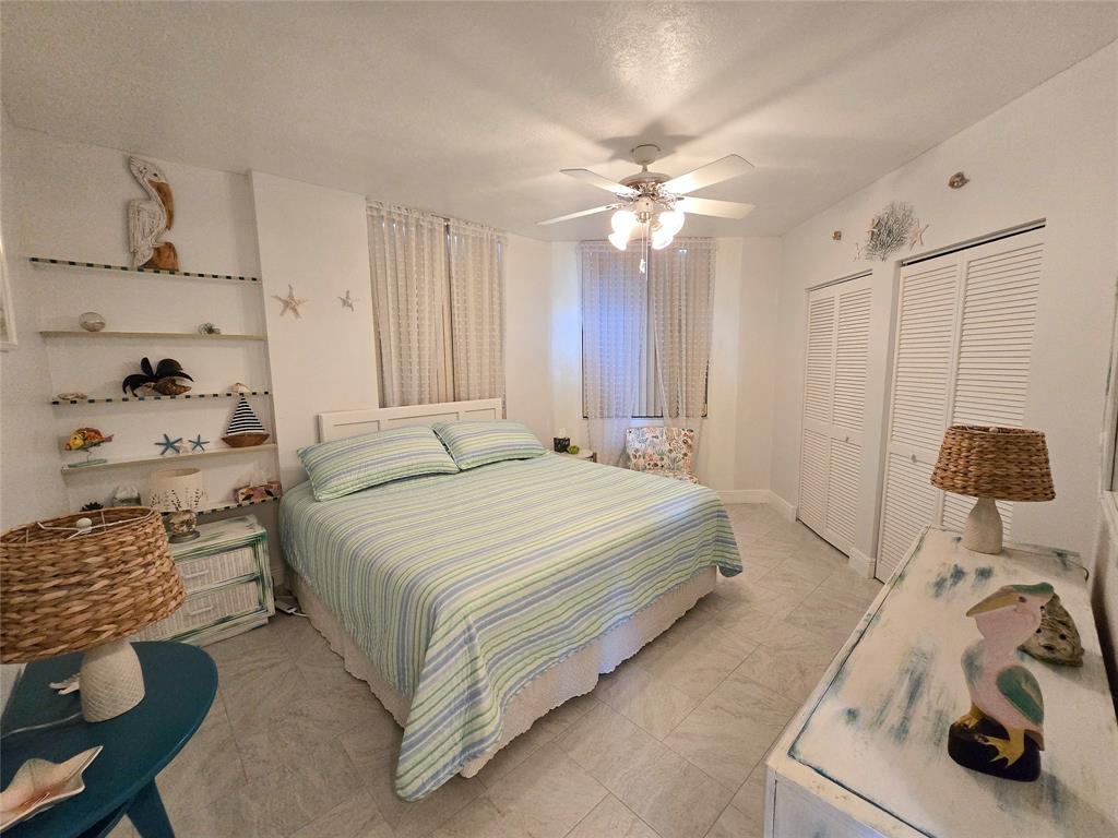 3120 North Hwy A1A, Unit 1302 Fort Pierce, FL 34949 - Photo 23 of 33 a bedroom with a bed and a window