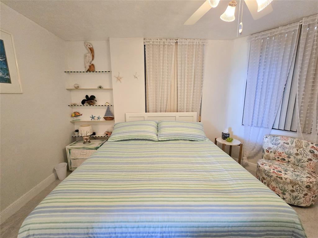 3120 North Hwy A1A, Unit 1302 Fort Pierce, FL 34949 - Photo 25 of 33 a room with a bed and a window