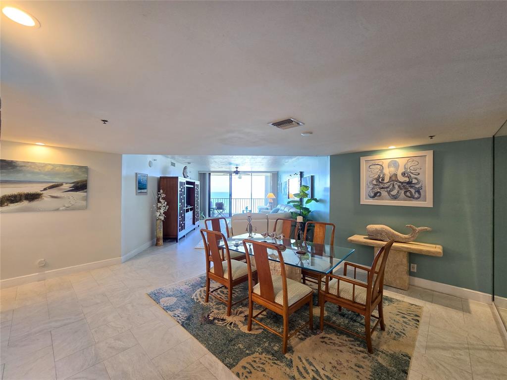 3120 North Hwy A1A, Unit 1302 Fort Pierce, FL 34949 - Photo 3 of 33 a view of a dining room with furniture