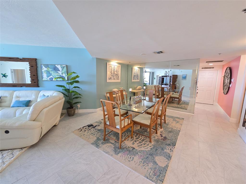 3120 North Hwy A1A, Unit 1302 Fort Pierce, FL 34949 - Photo 6 of 33 a view of a dining room with furniture and a potted plant