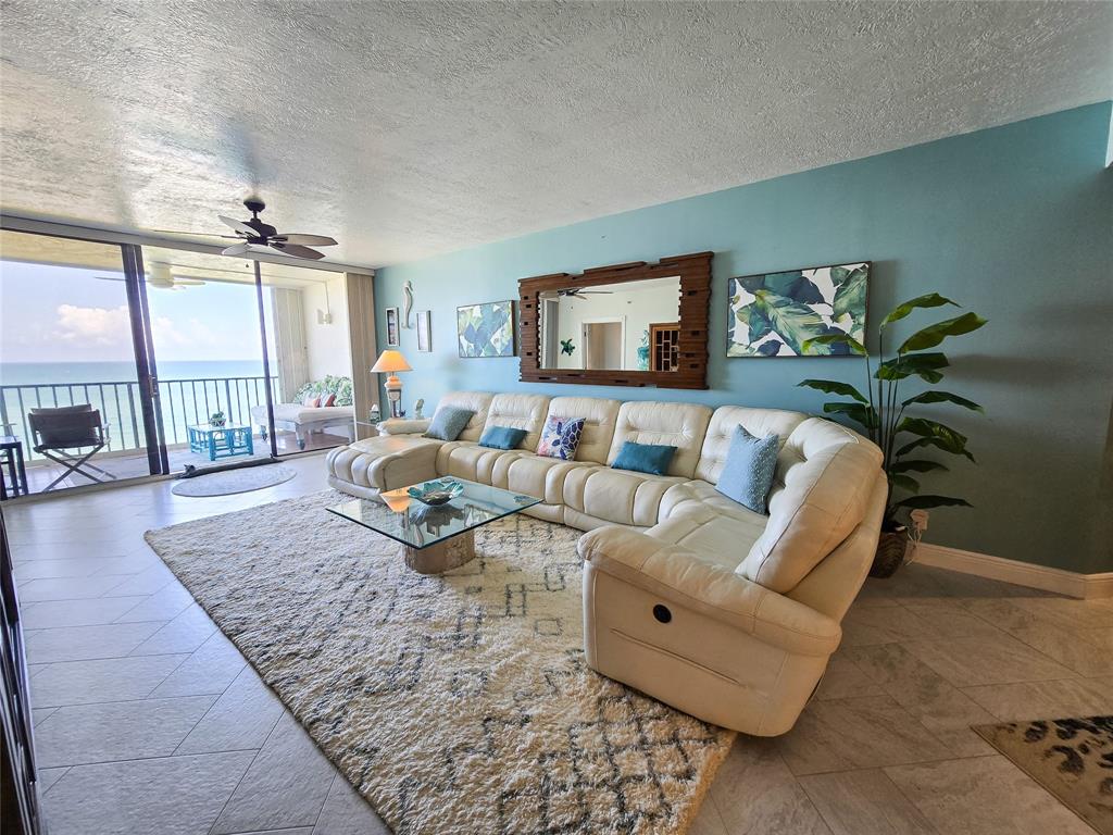 3120 North Hwy A1A, Unit 1302 Fort Pierce, FL 34949 - Photo 7 of 33 a living room with furniture and a rug