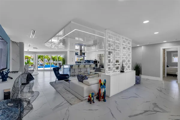 a lobby with furniture and a potted plant