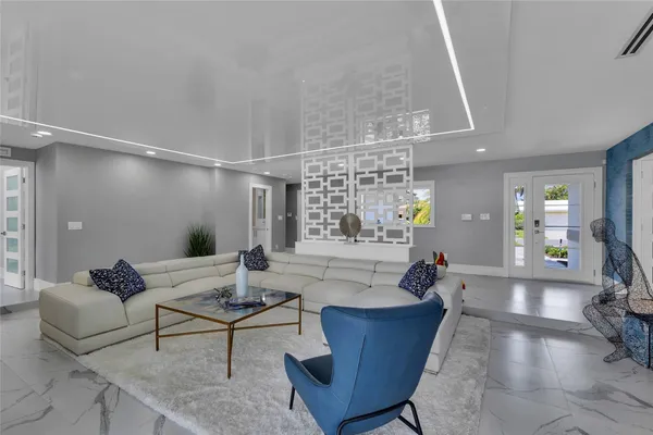 a kitchen with stainless steel appliances kitchen island granite countertop a sink and cabinets
