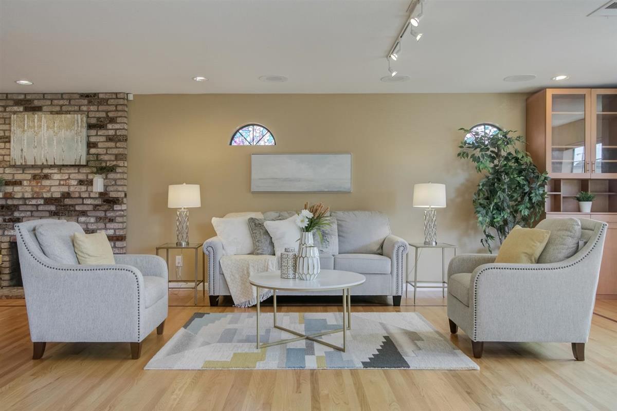 38061 Blacow Road Fremont, CA 94536 - Photo 11 of 65 a living room with furniture and a potted plant