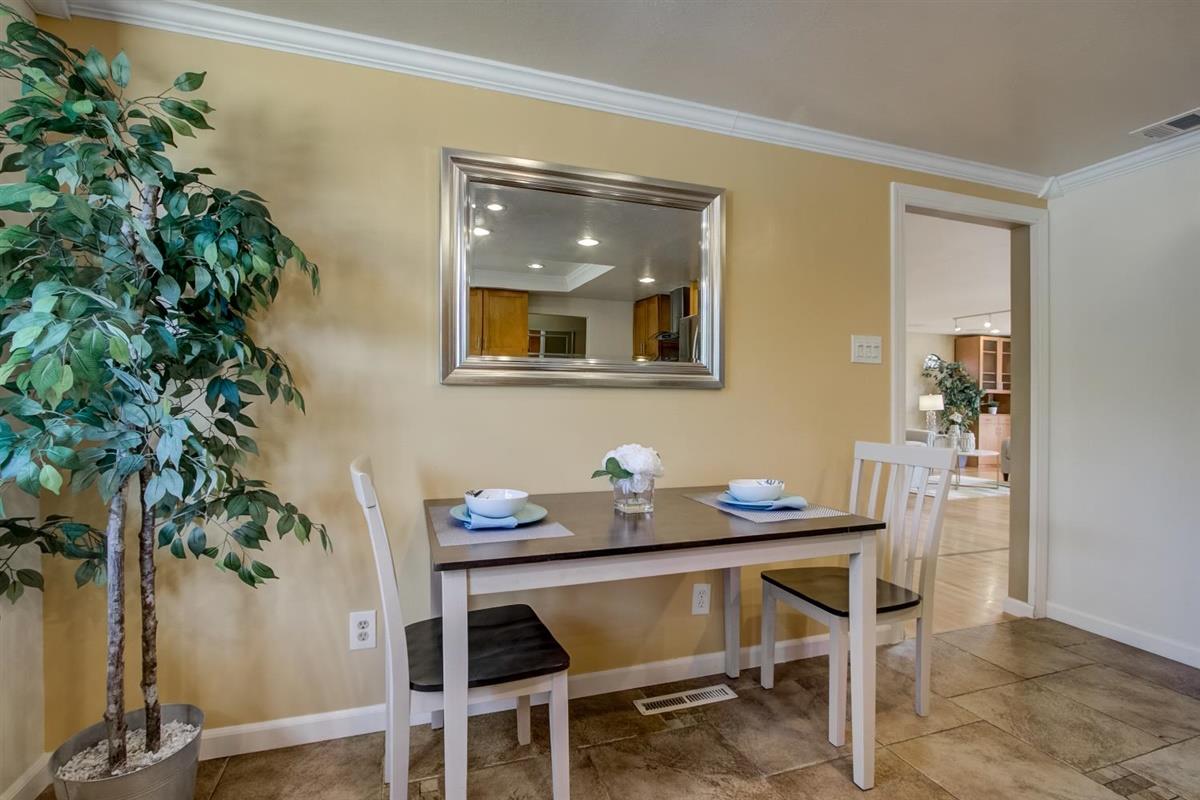 38061 Blacow Road Fremont, CA 94536 - Photo 23 of 65 a dining room with furniture and wooden floor