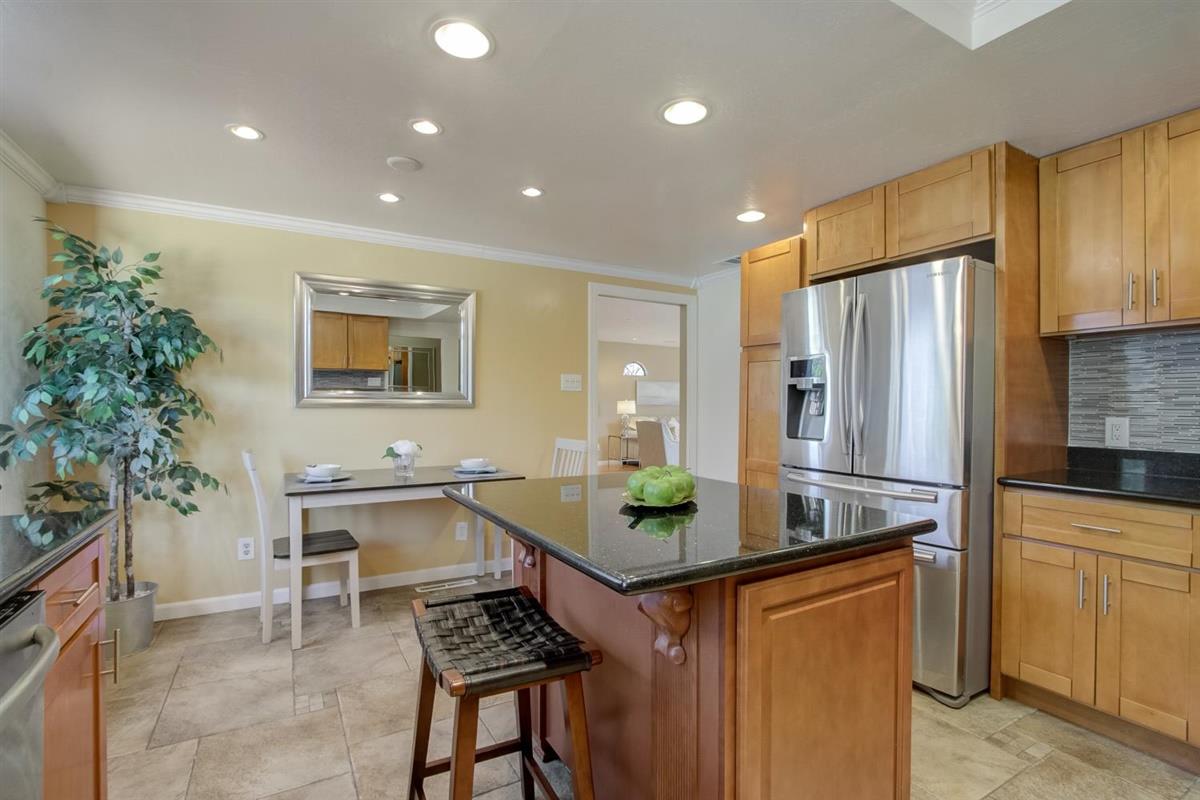 38061 Blacow Road Fremont, CA 94536 - Photo 29 of 65 a kitchen with stainless steel appliances granite countertop a refrigerator and a sink