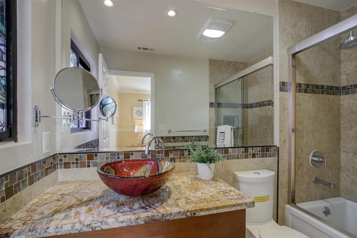 38061 Blacow Road Fremont, CA 94536 - Photo 40 of 65 a view of a bathroom sink and a mirror
