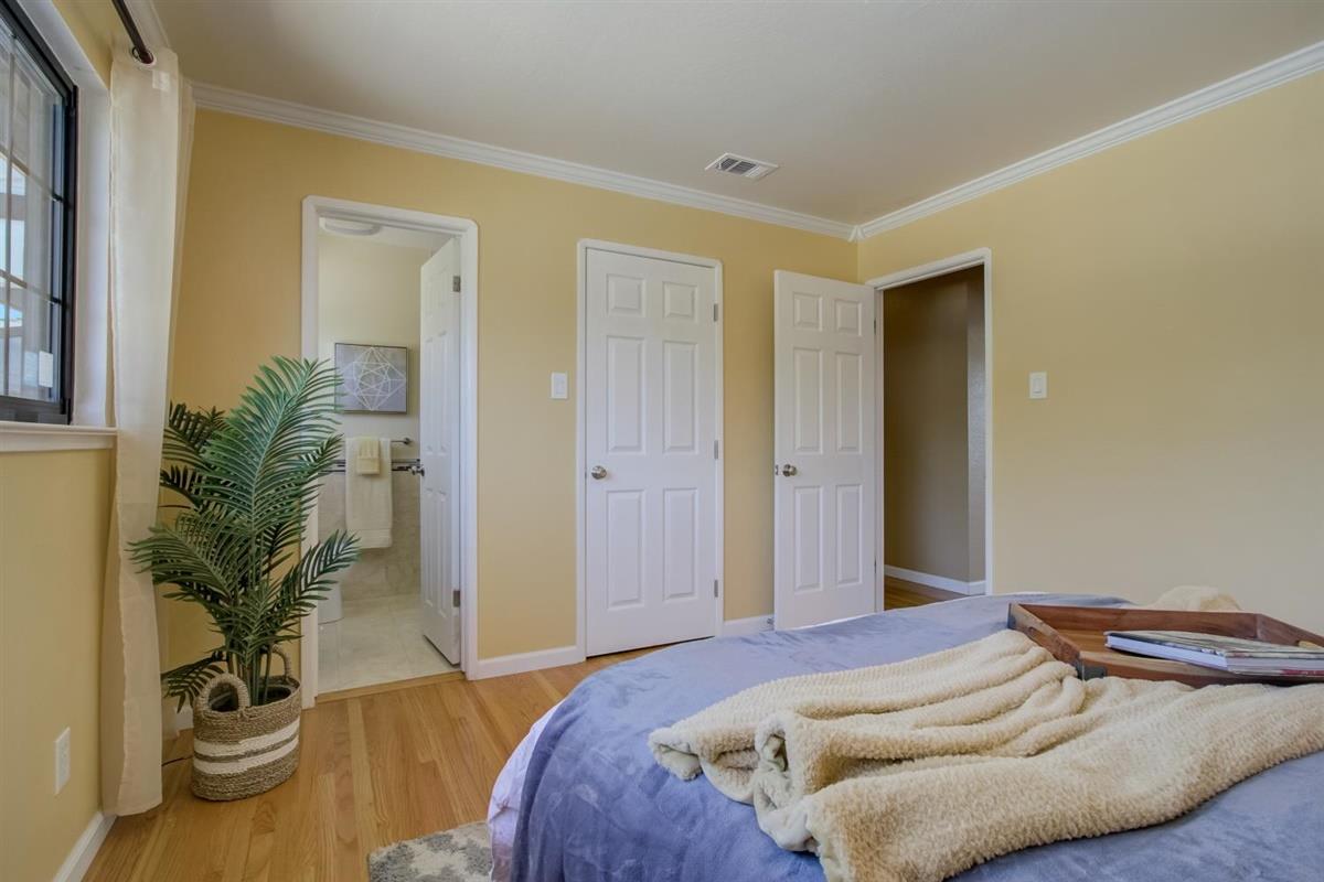 38061 Blacow Road Fremont, CA 94536 - Photo 44 of 65 a bedroom with a bed and potted plant