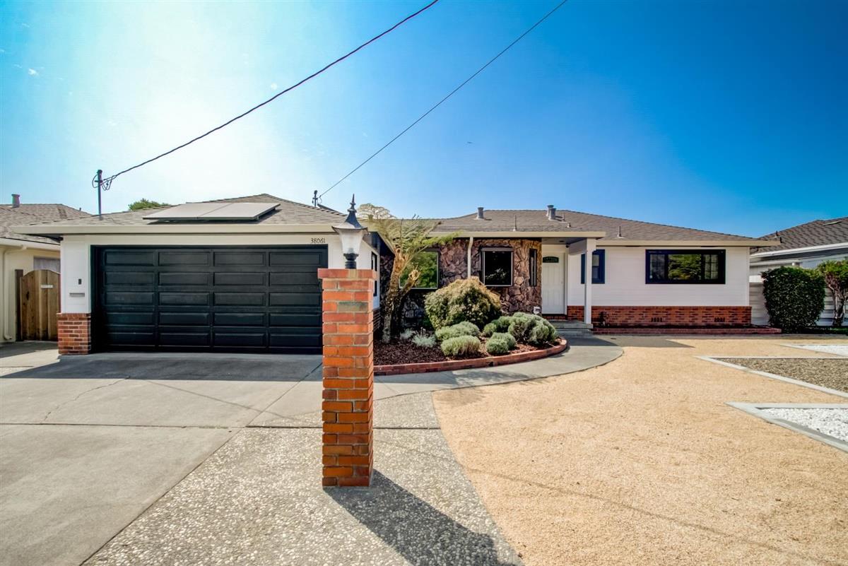 38061 Blacow Road Fremont, CA 94536 - Photo 49 of 65 a front view of a house with yard and hallway