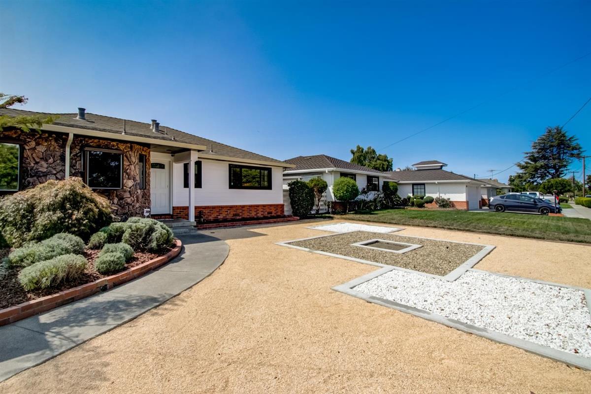 38061 Blacow Road Fremont, CA 94536 - Photo 51 of 65 a front view of a house with a yard