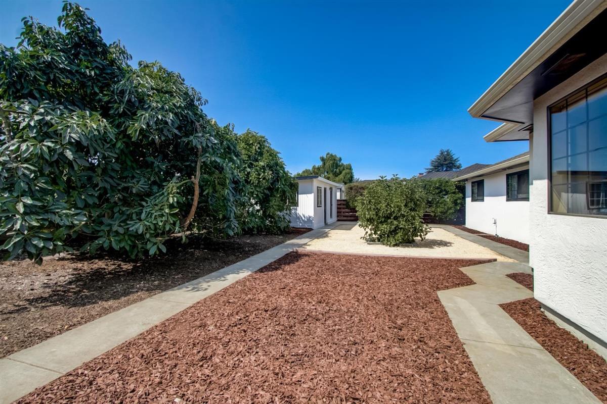 38061 Blacow Road Fremont, CA 94536 - Photo 59 of 65 a front view of a house with a yard and a garage
