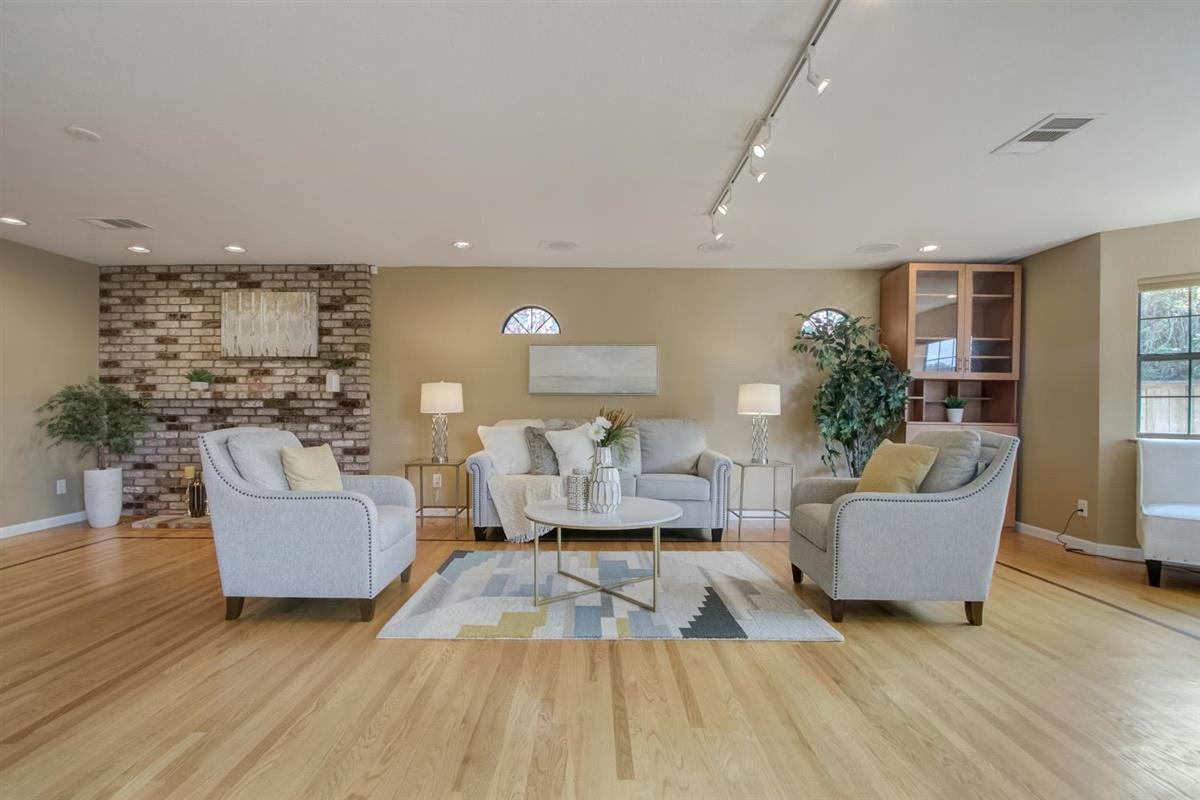 38061 Blacow Road Fremont, CA 94536 - Photo 10 of 65 a living room with furniture and a wooden floor