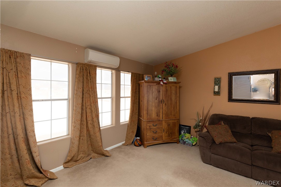 1464 South Dragoon Road Golden Valley, AZ 86413 - Photo 11 of 47 a view of livingroom with furniture and windows
