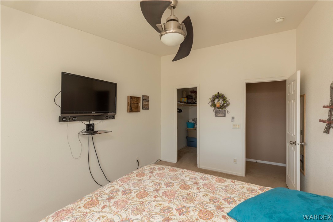 1464 South Dragoon Road Golden Valley, AZ 86413 - Photo 19 of 47 a view of a livingroom with wooden floor and a flat screen tv