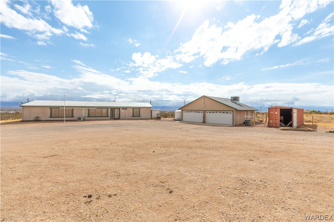 1464 South Dragoon Road Golden Valley, AZ 86413 - Photo 2 of 47 a front view of a house with a yard