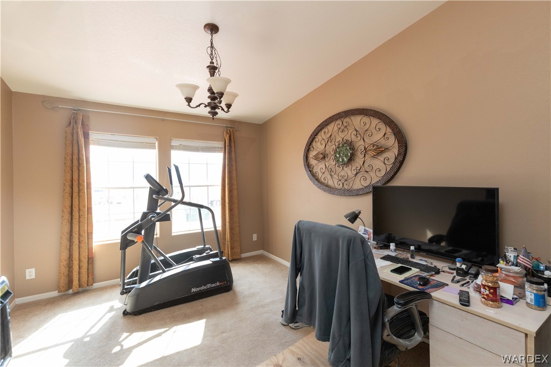 1464 South Dragoon Road Golden Valley, AZ 86413 - Photo 24 of 47 a view of a workspace with furniture and a window