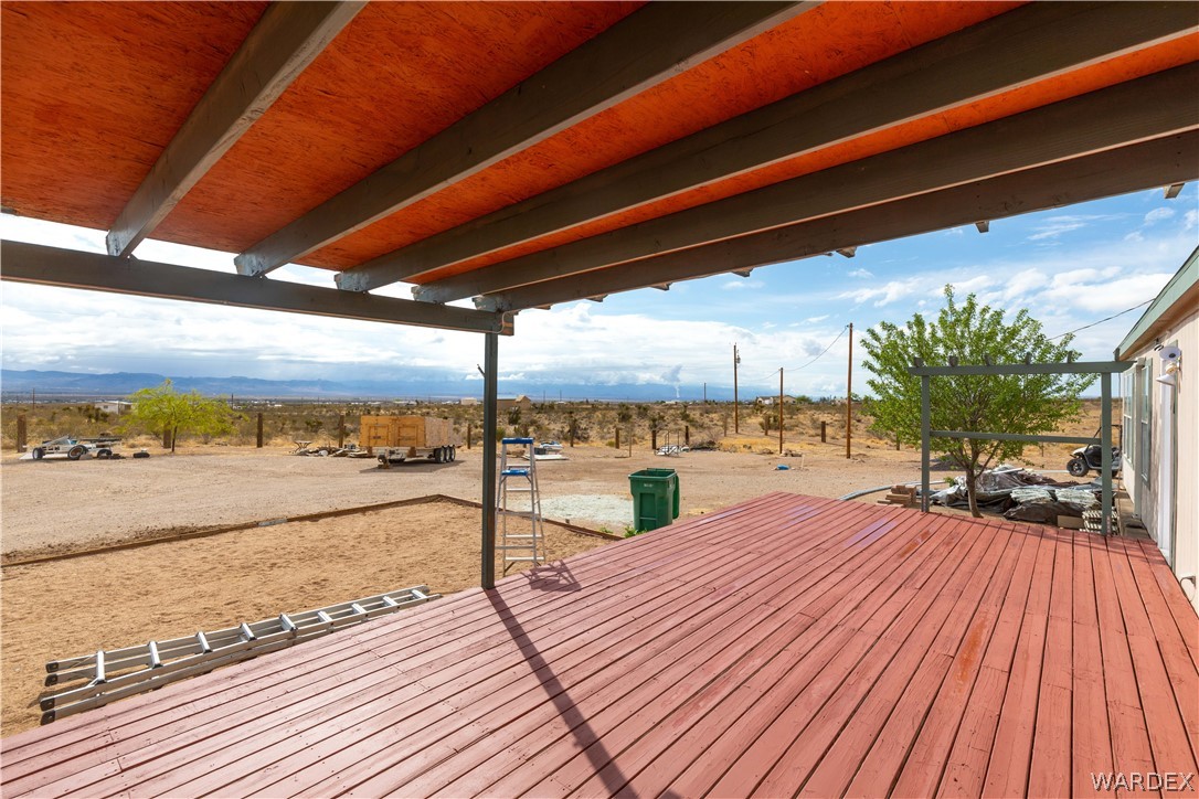 1464 South Dragoon Road Golden Valley, AZ 86413 - Photo 26 of 47 a view of a balcony with wooden floor