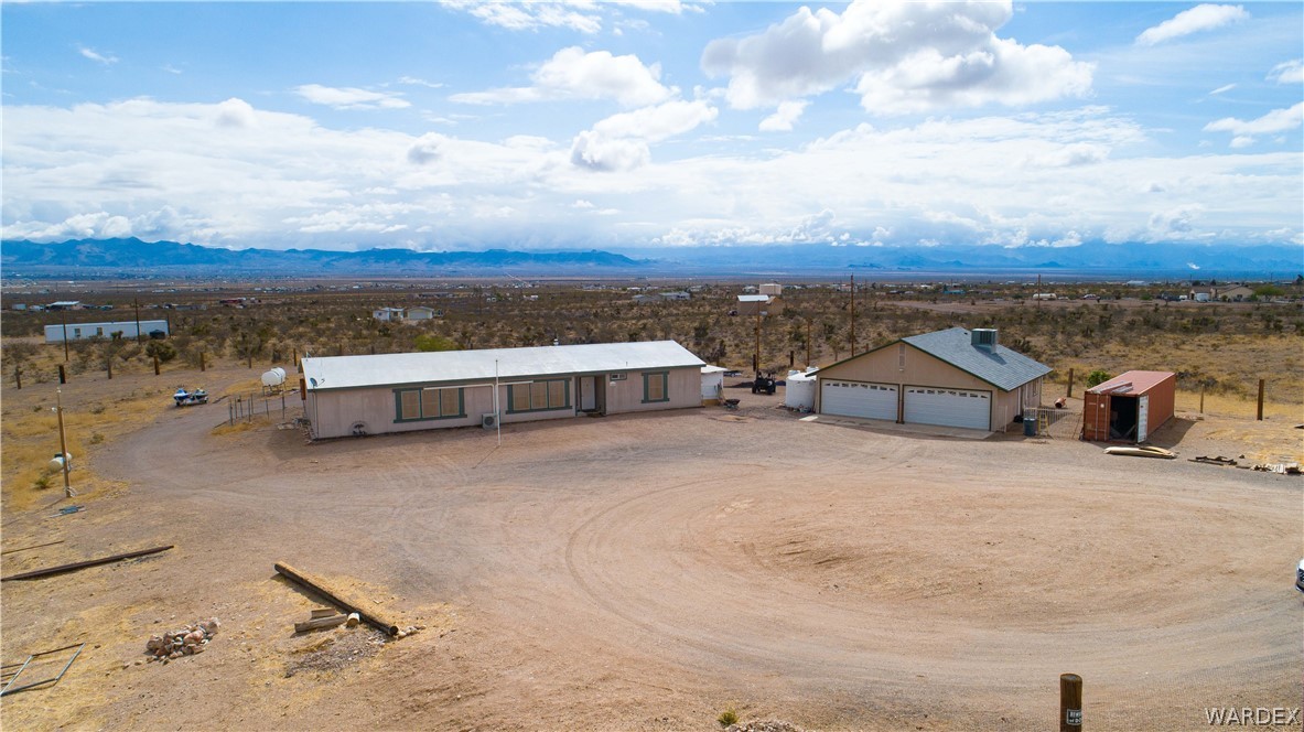 1464 South Dragoon Road Golden Valley, AZ 86413 - Photo 41 of 47 an aerial view of a house with a yard