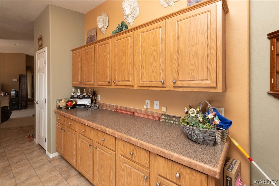 1464 South Dragoon Road Golden Valley, AZ 86413 - Photo 9 of 47 a kitchen with sink cabinets and utility room