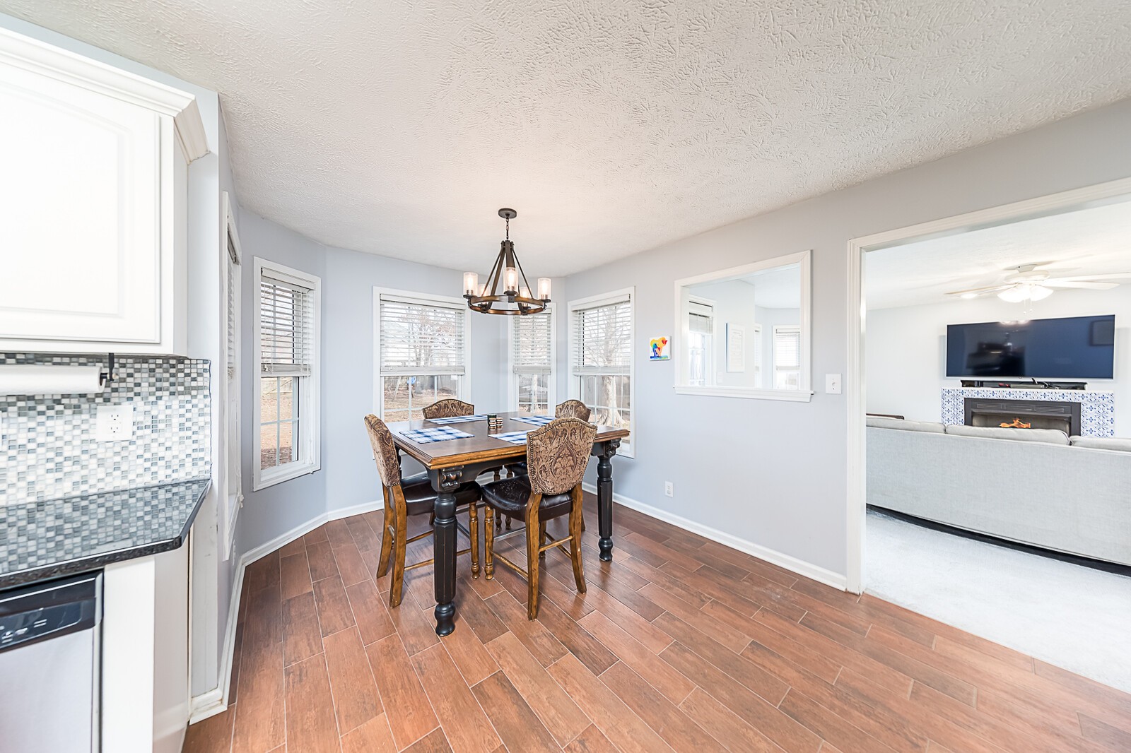 3721 Trough Springs Road Adams, TN 37010 - Photo 14 of 38 a view of a dining room with furniture and wooden floor