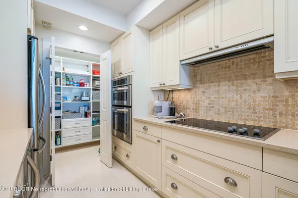 a kitchen with stainless steel appliances a refrigerator and cabinets