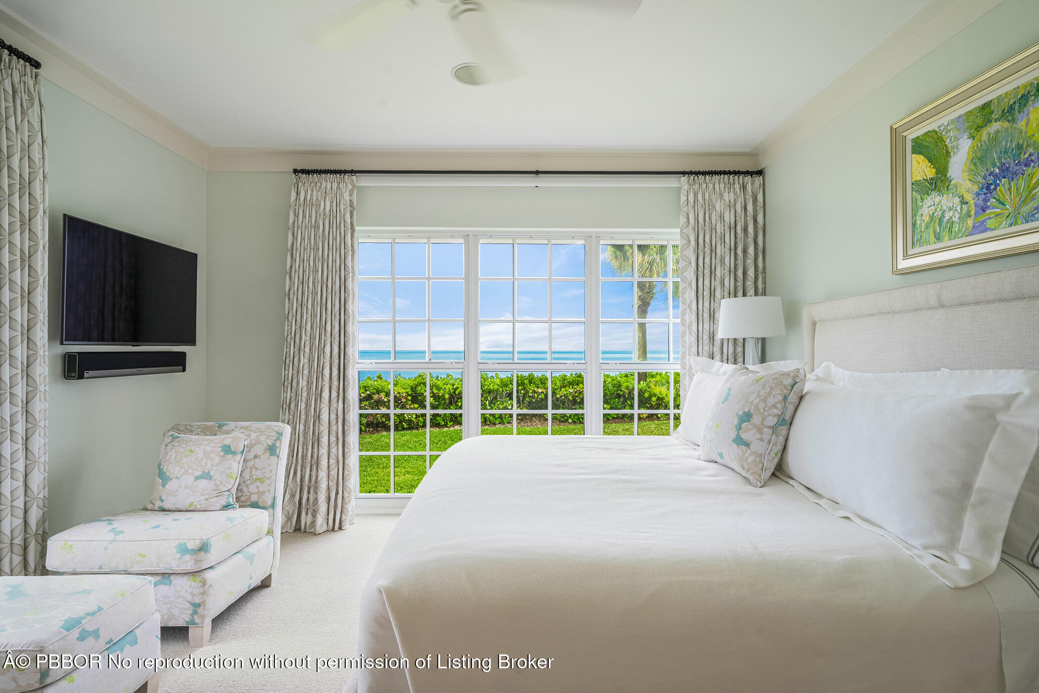 750 Beach Road, Unit 102 Vero Beach, FL 32963 - Photo 22 of 28 a living room with furniture and a flat screen tv