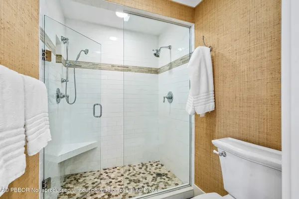 a bathroom with a shower and a toilet