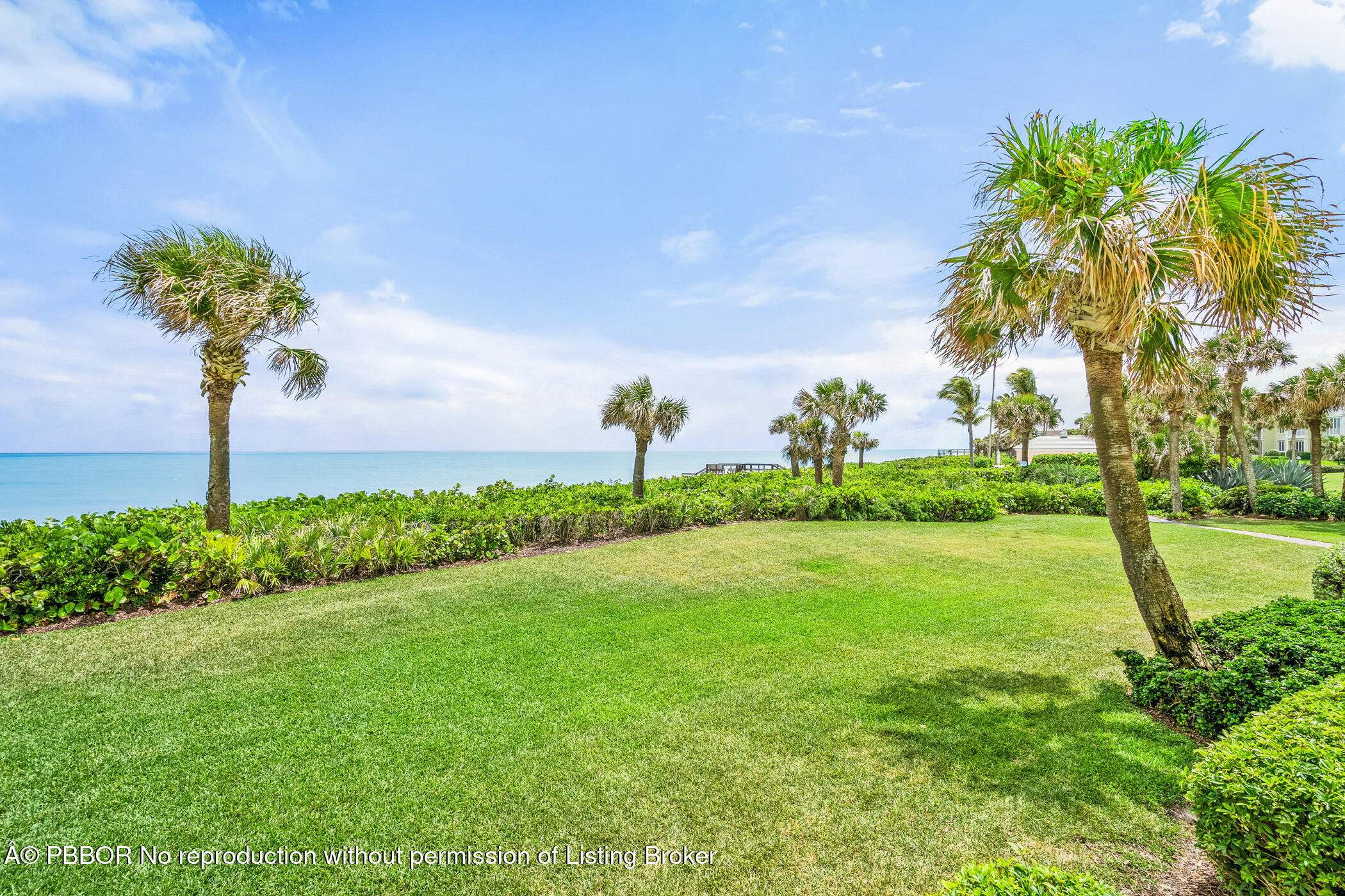 750 Beach Road, Unit 102 Vero Beach, FL 32963 - Photo 27 of 28 a view of a garden with a tree