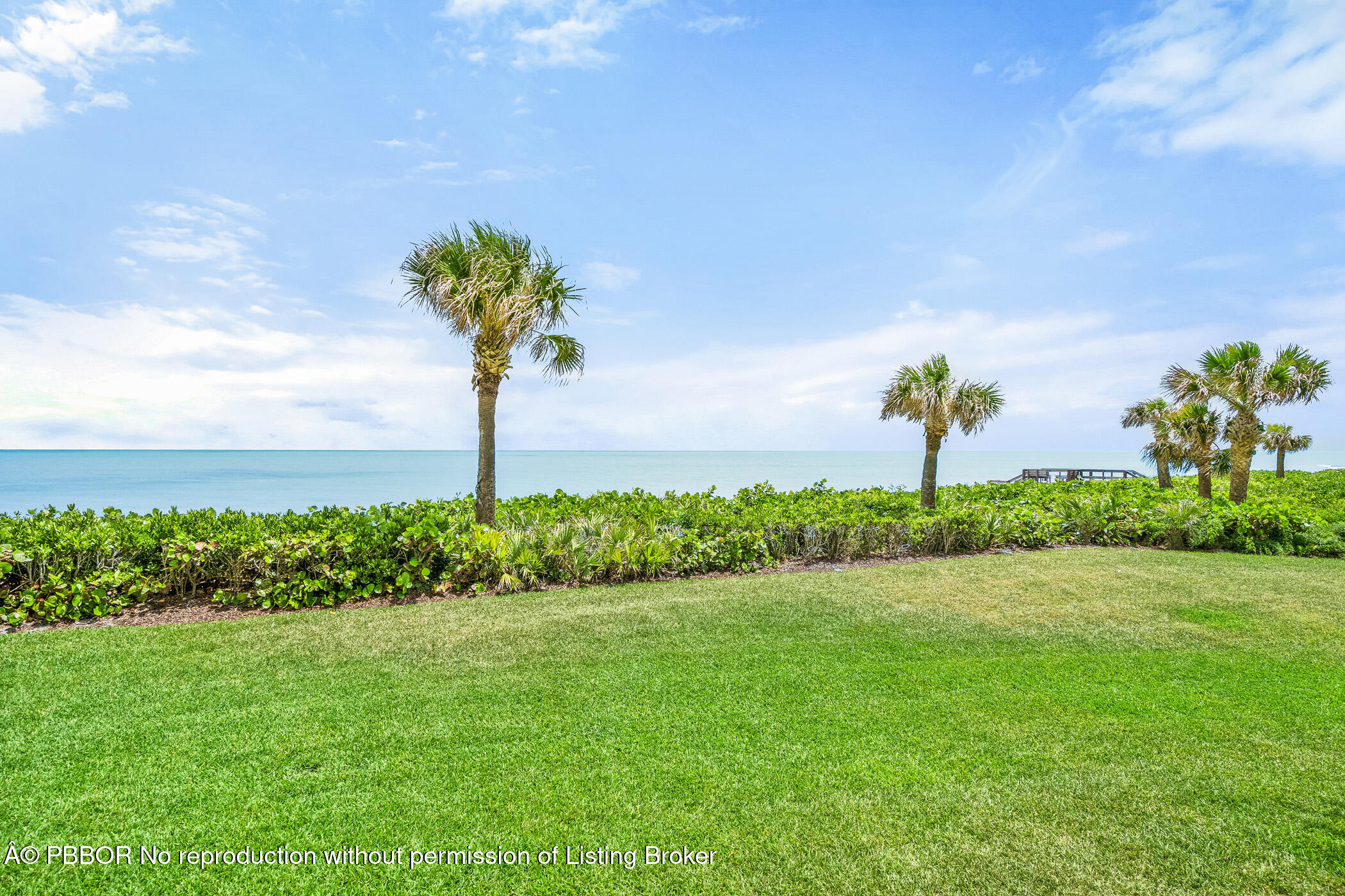 750 Beach Road, Unit 102 Vero Beach, FL 32963 - Photo 28 of 28 a front view of a house with a yard and garage
