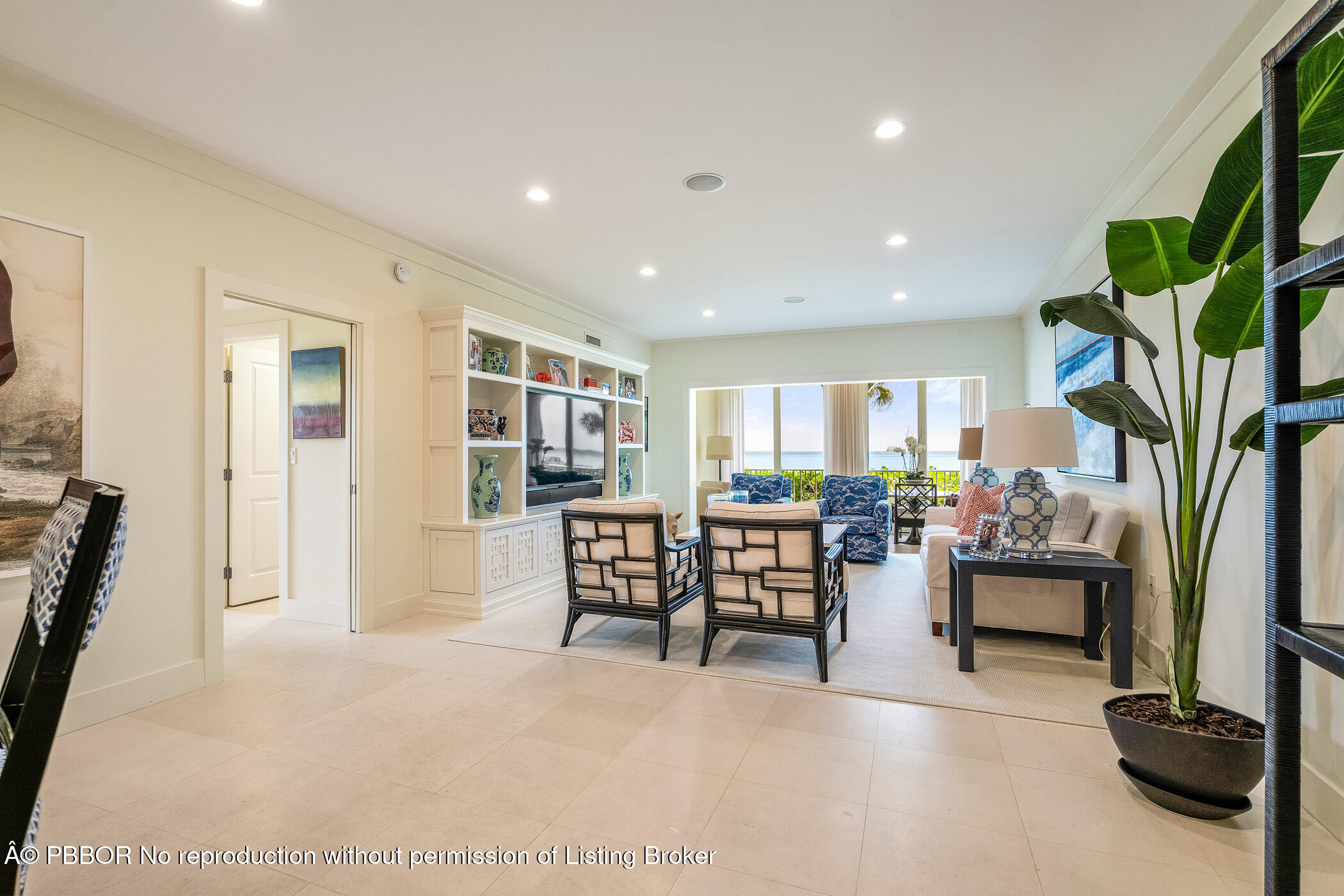 750 Beach Road, Unit 102 Vero Beach, FL 32963 - Photo 3 of 28 a dining room with furniture and a floor to ceiling window